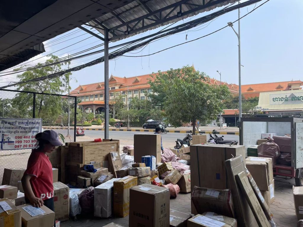 Inside the ZTO Express Siem Reap warehouse with stacked packages