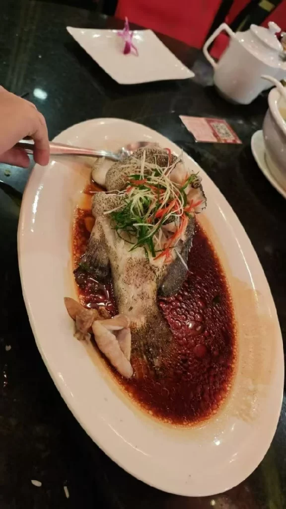 A sumptuous Chinese meal: grouper, roast duck, and sizzling beef short ribs.